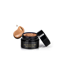 May Lindstrom skin product with a black jar and brown cream on a white background