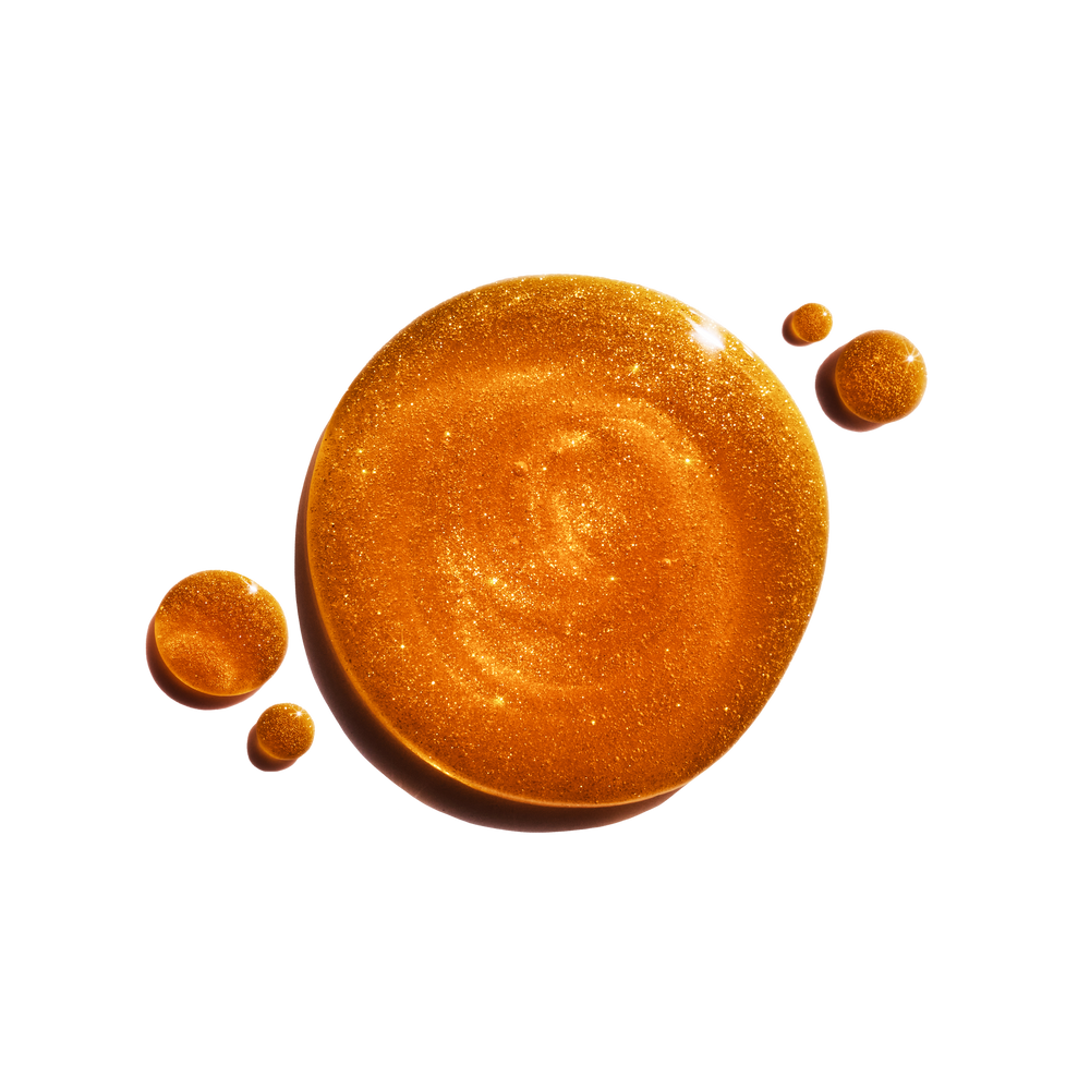 Amber-colored liquid droplets on a transparent background