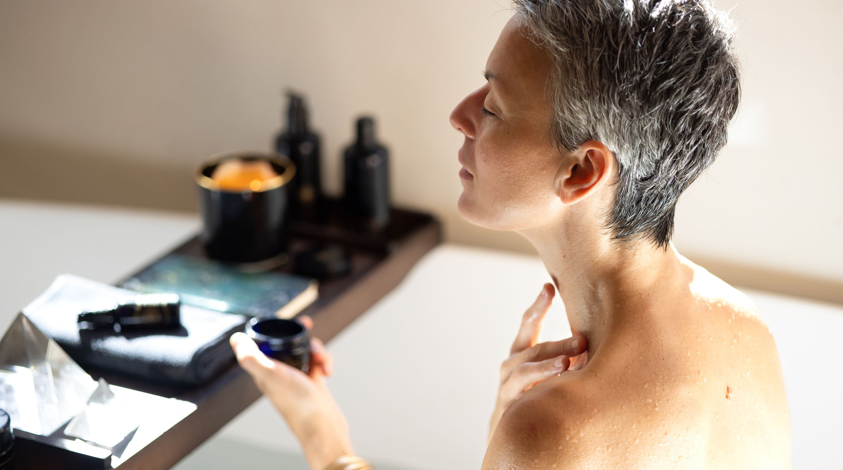 Woman giving a neck massage in a spa setting