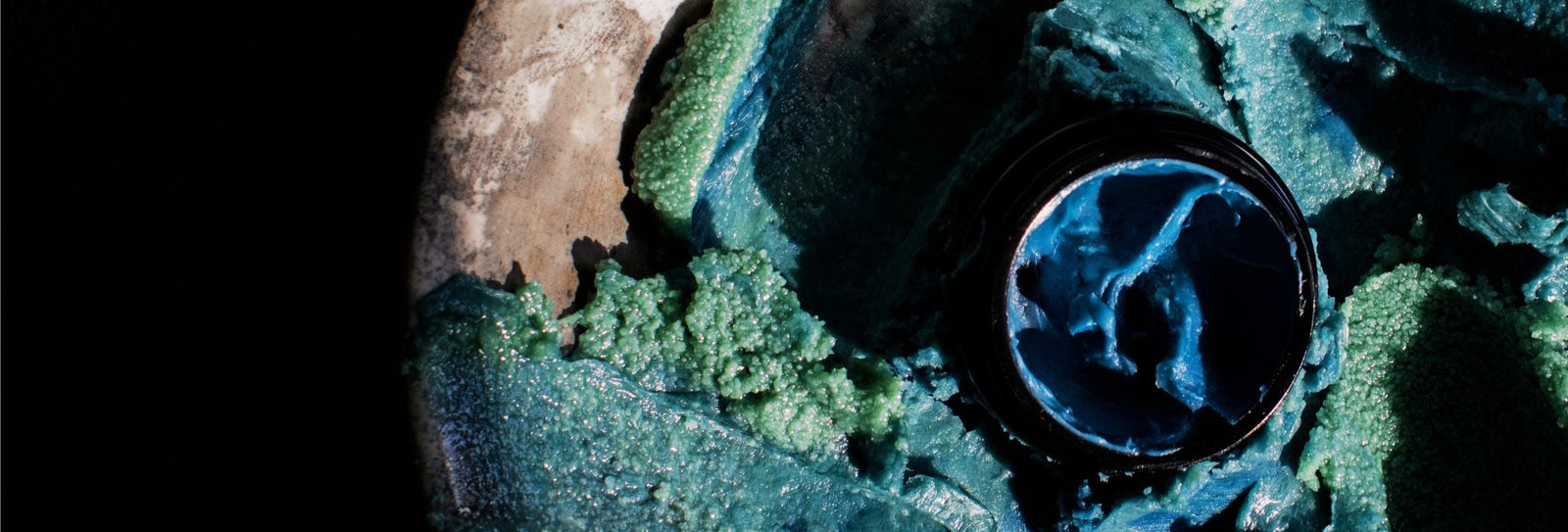 Close-up of a black object with a textured surface on a dark background