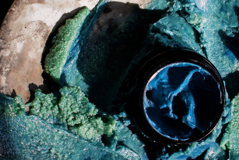 Close-up of a black object with a textured surface on a dark background